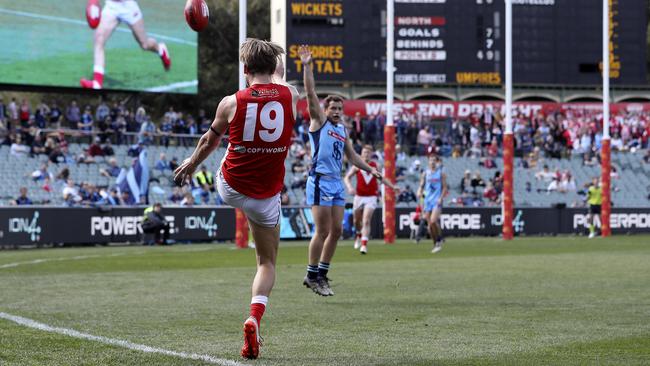 North’s Lewis Hender kicks a goal from the pocket against Sturt yesterday. Picture: Sarah Reed