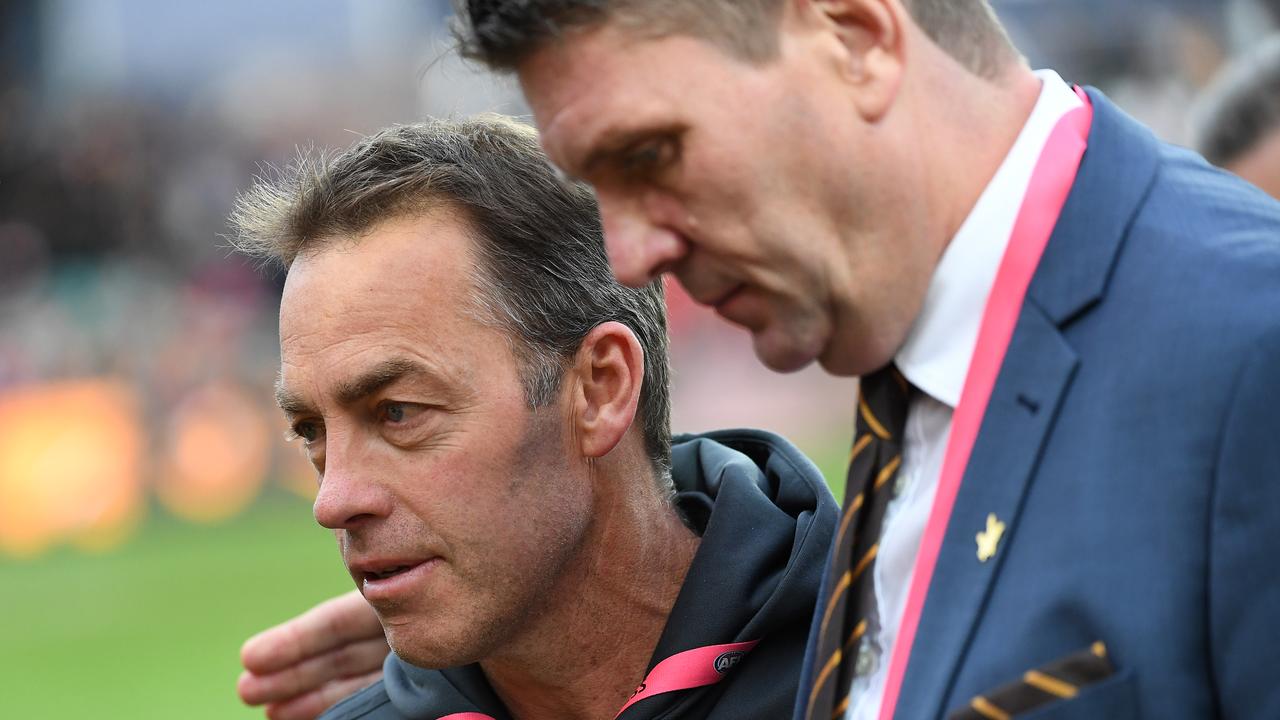 Hawks coach Alastair Clarkson (left) and Hawthorn chief executive Justin Reeves leave the field after the Round 19 AFL match between the Hawthorn Hawks and the Brisbane Lions at the University of Tasmania Stadium in Launceston, Saturday, July 27, 2019. (AAP Image/Julian Smith) NO ARCHIVING, EDITORIAL USE ONLY