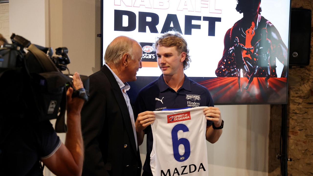 Malcolm Blight presents Jason Horne-Francis with the No.6 jumper. Picture: AFL Photos via Getty Images