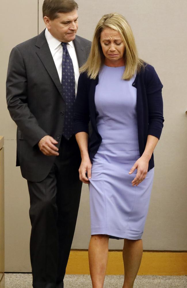 Amber Guyger is led off the witness stand by her attorney Toby Shook. Picture: Tom Fox/The Dallas Morning News via AP