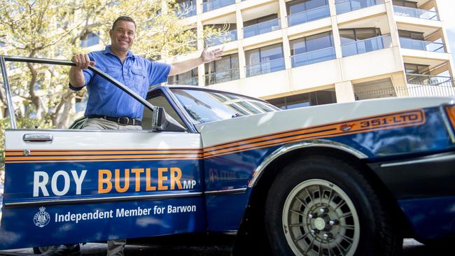 Roy Butler MP with his 1979 Ford FC LTD that he has wrapped in political branding outside NSW Parliament House . Photo Jeremy Piper