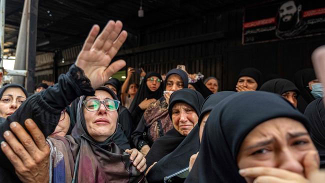 Women mourn during the funeral of two children, Hassan and Amira Muhammed Fadallah, a day after they were killed in an Israeli strike on a building in Beirut's southern suburbs, on July 31. Picture: AFP