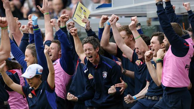 2016: The Western Bulldogs snap a 62-year premiership drought by beating the Sydney Swans in the Grand Final. Bulldogs captain Bob Murphy famously misses the game with a knee injury but is presented with coach Luke Beveridge’s premiership medallion on the dais. Picture: Wayne Ludbey