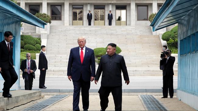 PANMUNJOM, SOUTH KOREA - JUNE 30: (SOUTH KOREA OUT): A handout photo provided by Dong-A Ilbo of North Korean leader Kim Jong Un and U.S. President Donald Trump inside the demilitarized zone (DMZ) separating the South and North Korea on June 30, 2019 in Panmunjom, South Korea. U.S. President Donald Trump and North Korean leader Kim Jong-un briefly met at the Korean demilitarized zone (DMZ) on Sunday, with an intention to revitalize stalled nuclear talks and demonstrate the friendship between both countries. The encounter was the third time Trump and Kim have gotten together in person as both leaders have said they are committed to the "complete denuclearization" of the Korean peninsula. (Photo by Handout/Dong-A Ilbo via Getty Images) *** BESTPIX ***