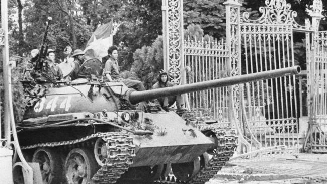 A tank enters the gates of the presidential palace in 1975 in what was then Saigon. Picture: Frances Starne/AP