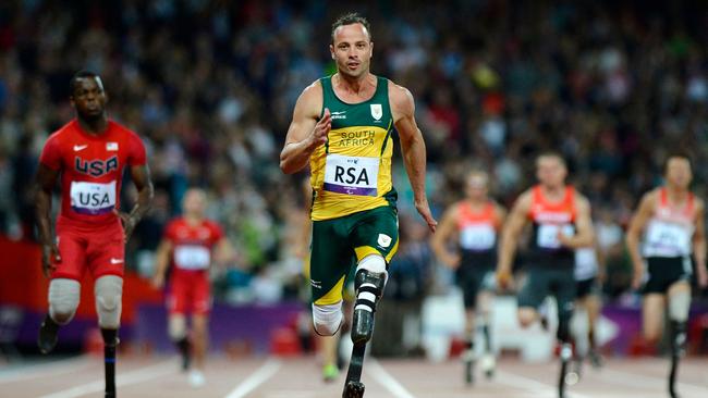 South Africa's Oscar Pistorius runs across the finish line at the London 2012 Paralympic Games. (Photo by ADRIAN DENNIS / AFP)