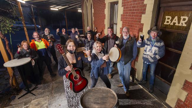 Happy patrons have their first beer at the Kangaroo Pub in Maldon after lockdown. Picture: Rob Leeson.