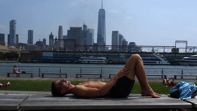 A man sunbathes during New York’s heatwave. Picture: AFP