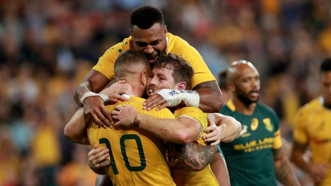 Bernard Foley celebrates with Quade Cooper. Picture: Darren England