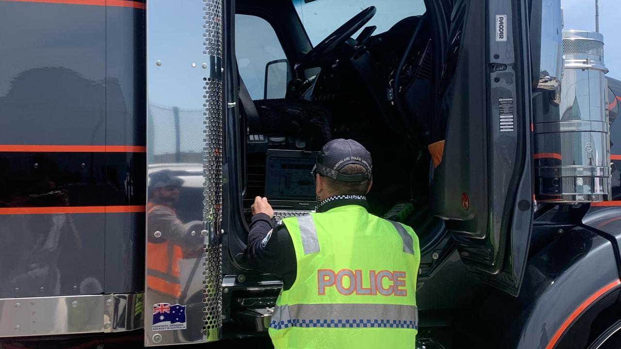 Police pull over a truck in a random check at the Port of Brisbane.