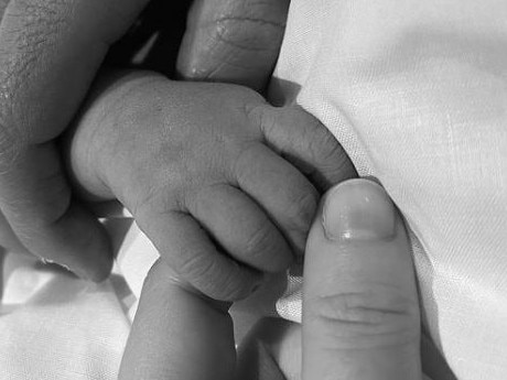 Princess Eugenie posted this photo of her and husband Jack Brooksbank holding the yet-to-be-named baby boy's hand. Picture: Instagram