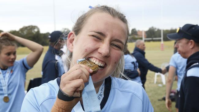 CHS1's Charlie Norton with her medal. Girls Rugby Sevens Grand Final. CHS1 (light blue) v CCC1 (dark blue). Action from game. Junior Rugby. NSW Schools Rugby union trials at Eric Tweedale Oval. Picture: John Appleyard