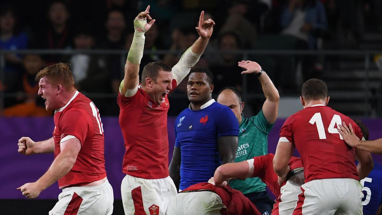 Wales players react after Ross Moriarty scored a try at Oita Stadium.