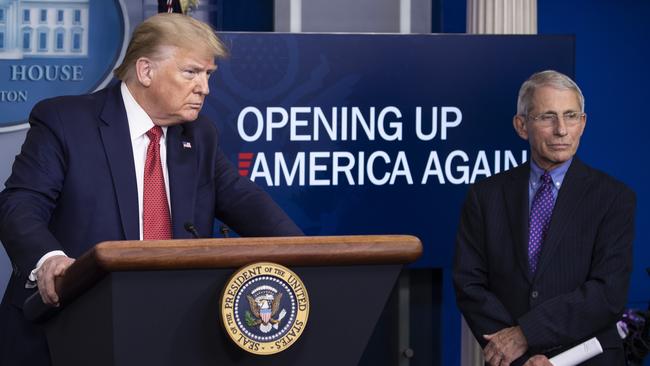 President Donald Trump and Dr Anthony Fauci, director of the National Institute of Allergy and Infectious Diseases, address the media last month. Dr Fauci is now in quarantine. Picture: AP