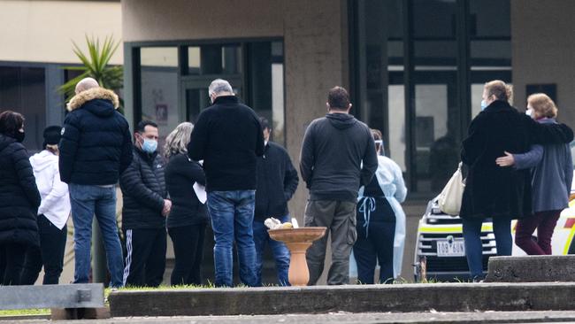 Upset families of residents gathered at St Basil’s during the lockout. Picture: Sarah Matray