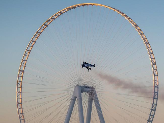 CORRECTION - A handout picture released by the Expo 2020 on February 17, 2020, shows Vince Reffet, known as Jetman, taking part in a flight in the Emirati city of Dubai. (Photo by - / EXPO 2020 / AFP) / == RESTRICTED TO EDITORIAL USE - MANDATORY CREDIT "AFP PHOTO / HO / EXPO 2020" - NO MARKETING NO ADVERTISING CAMPAIGNS - DISTRIBUTED AS A SERVICE TO CLIENTS == / “The erroneous mention[s] appearing in the metadata of this photo by - has been modified in AFP systems in the following manner: [Vince Reffet] instead of [Yves Rossy]. Please immediately remove the erroneous mention[s] from all your online services and delete it (them) from your servers. If you have been authorized by AFP to distribute it (them) to third parties, please ensure that the same actions are carried out by them. Failure to promptly comply with these instructions will entail liability on your part for any continued or post notification usage. Therefore we thank you very much for all your attention and prompt action. We are sorry for the inconvenience this notification may cause and remain at your disposal for any further information you may require.”