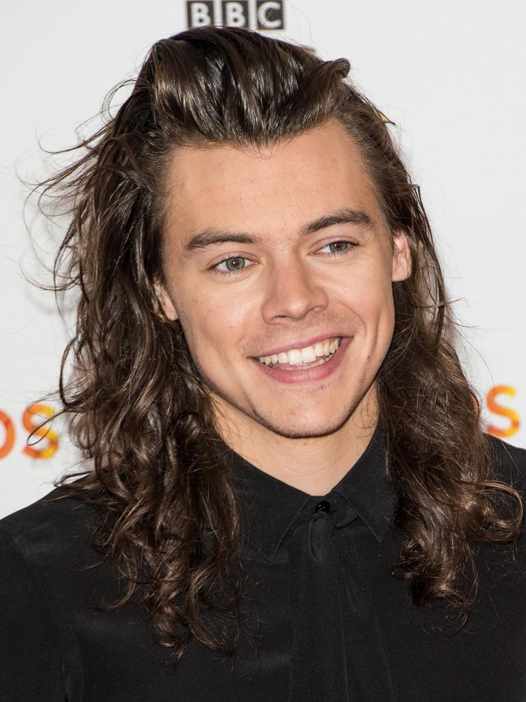 Harry Styles debuts shaved head at U2 concert with girlfriend Taylor  Russell