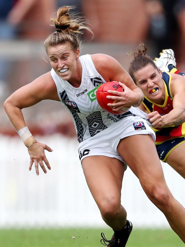 Ruby Schleicher tries to break a tackle. Picture: Sarah Reed/AFL Photos via Getty Images