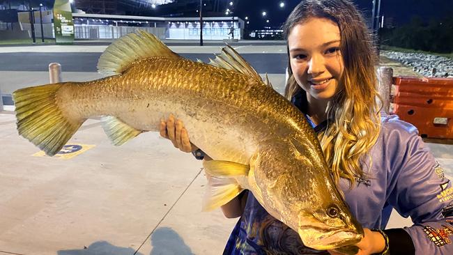 Billie Price, 14, with a good sized barramundi outside Queensland Country Bank Stadium.