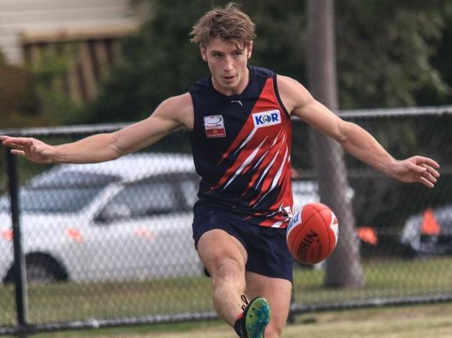 Waverley Blues footballer Simon Hawkins gets a kick away in the Eastern Football League (EFL). Picture: EFL