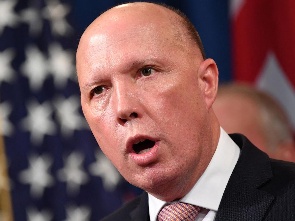 (FILES) A file photo taken on March 5, 2020 shows Australia's then-Home Affairs Minister Peter Dutton during a press conference at the Department of Justice in Washington, DC. - Dutton, who became Australia's new defence minister on March 29, 2021, is a hardline ex-cop who has overseen a controversial refugee policy, riled close ally New Zealand by deporting criminal Kiwis and publicly clashed with the Chinese government. (Photo by Mandel NGAN / AFP)