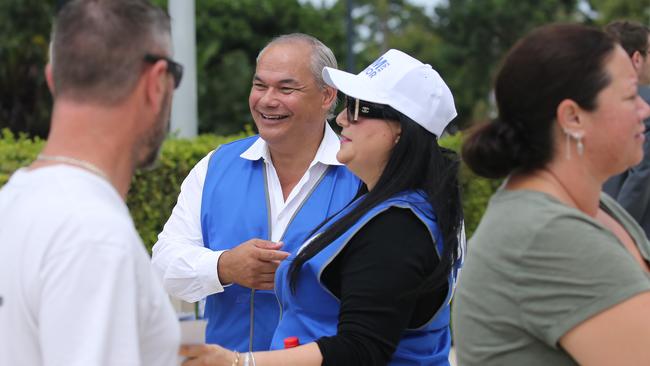 Mayor Tom hands out how to vote material at the Bundall polling booth at the council chambers. Picture: Glenn Campbell