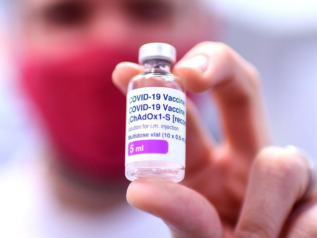 BRISBANE, AUSTRALIA - NewsWire Photos - AUGUST 8, 2021. Pharmacist Michael Thorp holds a vial of the AstraZeneca Covid-19 vaccine the at the Carina Day and Night pharmacy in Brisbane. Picture: NCA NewsWire / Dan Peled