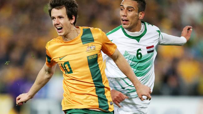 Australia's Robbie Kruse and Iraq's Ali Adnan Kadhim during the World Cup qualifier between Australia Socceroos and Iraq at Stadium Australia, Homebush, Sydney.