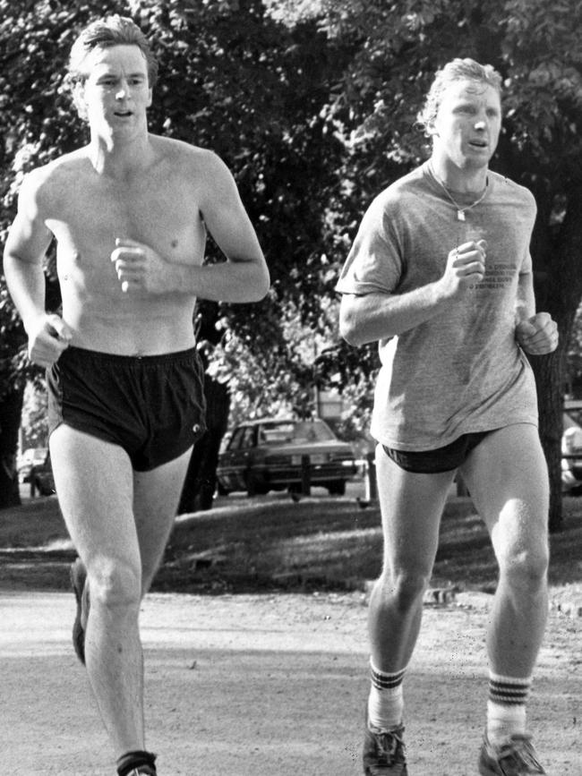 Neale Daniher and Stephen Carey during a training run around the tan in 1985