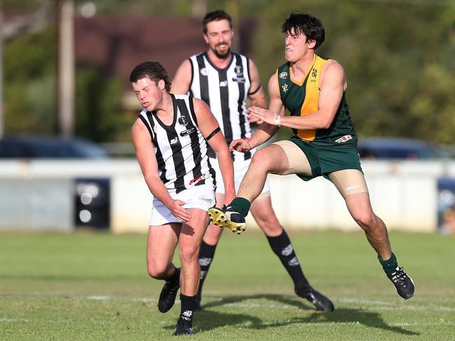 Marion’s Dean Conier kicks the ball during the third quarter of the Rams’ 282-point home loss to Reynella on Saturday. Picture: Stephen Laffer.