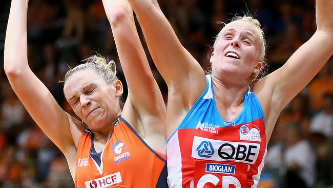 Jo Harten of the Giants and Maddy Turner of the Swifts contest possession in their round one thriller.