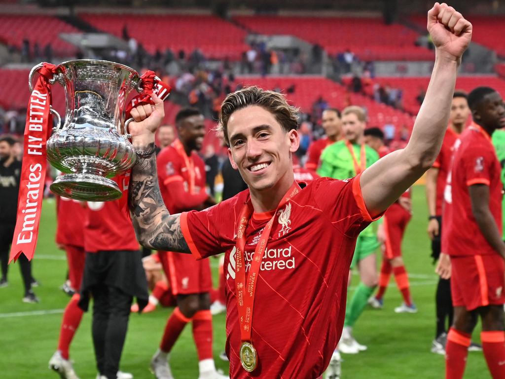 Liverpool defender Kostas Tsimikas celebrates with the trophy after winning the FA Cup final. Picture: Glyn Kirk/AFP