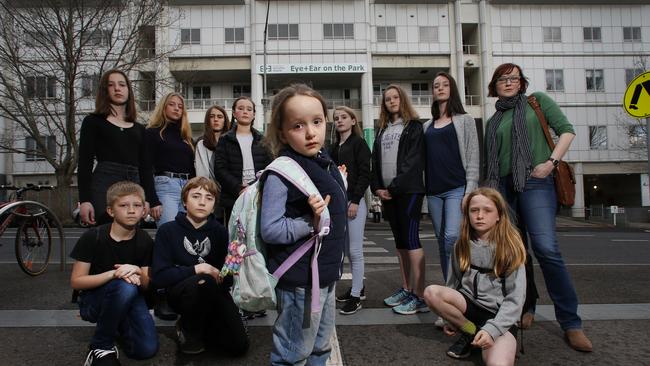 Inner-city families, including Rose, 7, calls for the former hospital to be converted to a school. Picture: David Caird