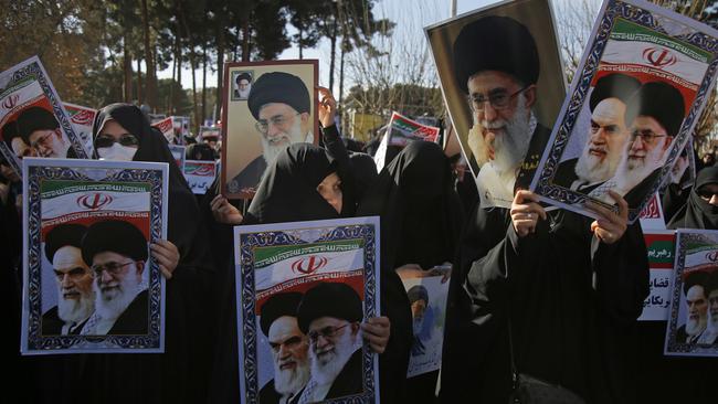 A pro-government rally last year, with posters of Iranian revolutionary founder Ayatollah Ruhollah Khomeini and Supreme Leader Ayatollah Ali Khamenei. Picture: AP