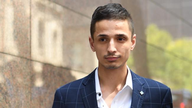 Angelo Gargasoulas, the younger brother of the alleged Bourke Street murderer, leaves Melbourne Magistrates Court, Melbourne, Thursday, March 2, 2017. The brother of the alleged Bourke Street murderer has pleaded guilty to an number of offences including intentionally causing injury, driving while unlicensed, and theft.