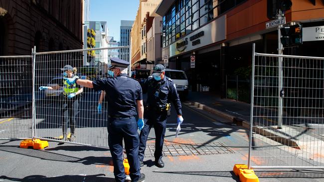 Police and medical staff around the Peppers Waymouth Hotel in Adelaide. Picture: Matt Turner.