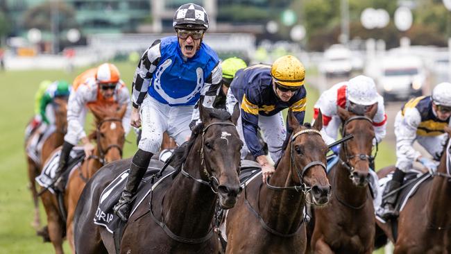 A delighted Mark Zahra crosses the finish line at Flemington on Gold Trip to win the 2022 Melbourne Cup on Tuesday. Picture: Jake Nowakowski