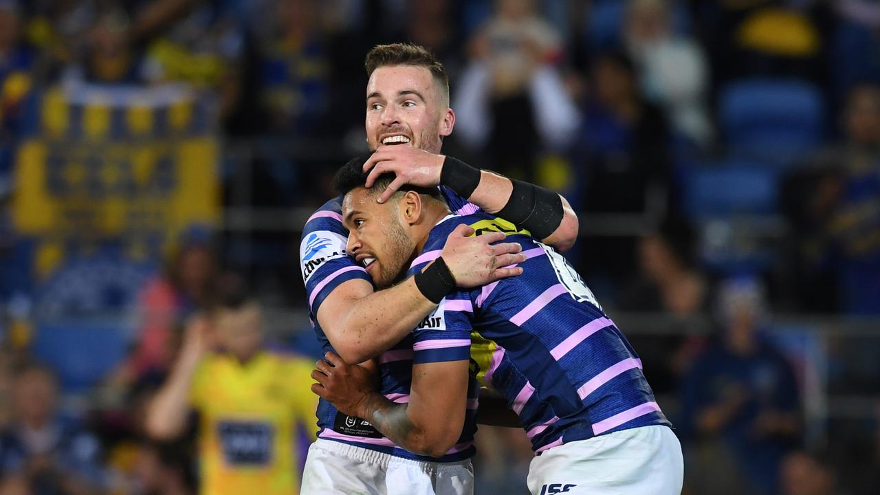 Waqa Blake celebrates a try with Eels teammate Clint Gutherson.