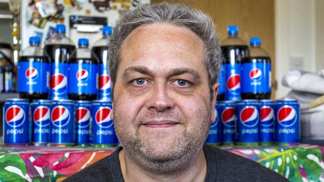 A supermarket worker who spent more than $12,000 a year on Pepsi, drinking up to 10 litres a day, has revealed how he beat the addiction cold turkey. Picture: Matthew Lofthouse / SWNS / MEGA