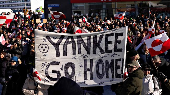 Protesters hold a banner reading "Yankee Go Home" during a march to the US consulate, in Nuuk, Greenland. Picture; AFP.