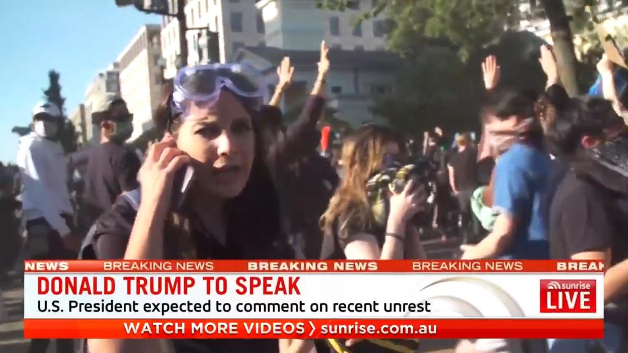 Seven News reporter Amelia Brace after her cameraman were pushed over by riot police. Picture: Sunrise