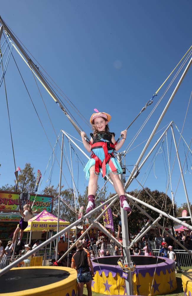 Huge crowds for the first day of the Gold Coast Show. Emily Trott, 4 learning to fly on the Superbungy. Picture: Glenn Hampson