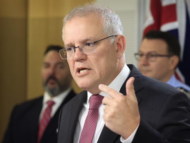 SYDNEY, AUSTRALIA - JUNE 08: Prime Minister Scott Morrison speaks to the media during a press conference on June 08, 2021 in Sydney, Australia. Mass raids and arrests have been made across Australia following a long-running law enforcement operation, where authorities used intelligence from a key encrypted communications platform relied on by organised crime figures to avoid police surveillance. Australian Federal Police have arrest 224 suspects and seized drugs, weapons, and cash in the operation. (Photo by Mark Evans/Getty Images)