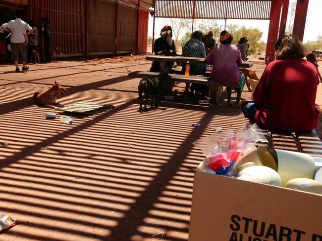 DECEMBER 10, 2004: Residents outside the general store at the Aboriginal community of Balgo, in the Kimberley. 10/12/04. Pic Leon Mead.Western Australia / Aborigines