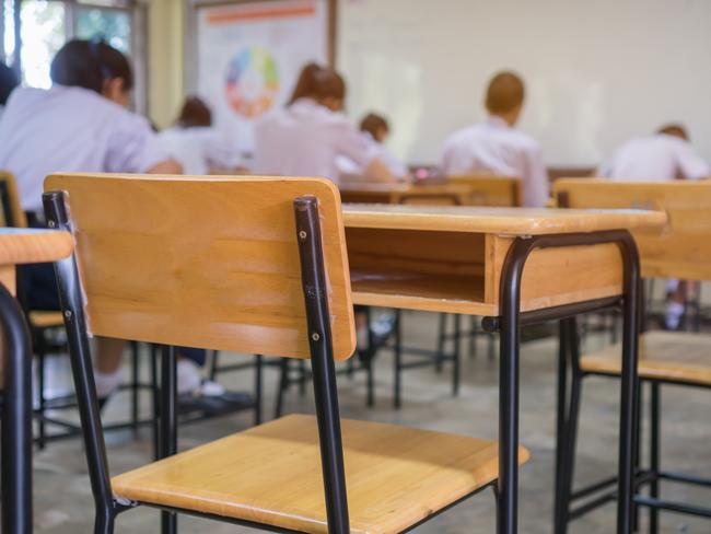 Lecture room or School empty classroom with Student taking exams, writing examination for studying lessons in high school thailand, interior of secondary education, whiteboard. educational concept