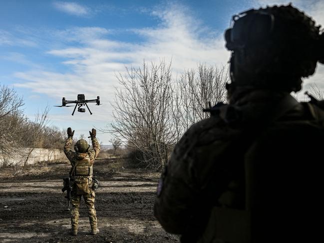 A Ukrainian serviceman flies a drone to spot Russian positions near the city of Bakhmut, in the region of Donbas. Ukraine says it shot down 13 Russian drones. Picture: AFP