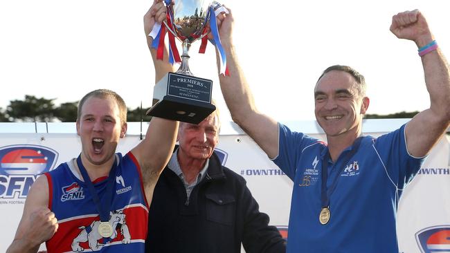 Captain Kieran Knox and coach Jason Heffernan show off the premiership cup to the club faithful. Picture: Hamish Blair