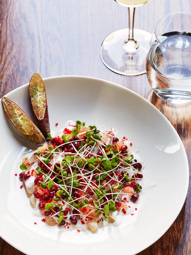 Raw yellow tail kingfish with fresh coconut cream, chilli, pomegranate seeds and finger lime. Picture: Marina Oliphant