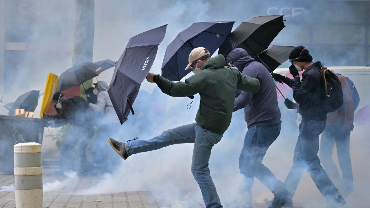 Police used tear gas on some unruly protesters. Picture: Lou Benoist/AFP