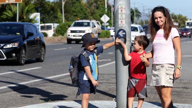 Lynette Heweston and her sons Oliver 6 and Hugo 4 on Sheridan St at the Mother of Good Counsel School in North Cairns PICTURE: ANNA ROGERS